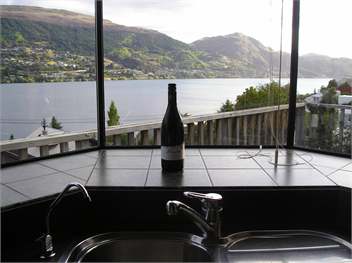 The kitchen is modern and has the most amazing vie