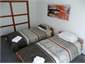 1 of 3 bedrooms in the "House" with 2 king singles