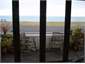 Lounge looking out to sea, bi-fold doors open out