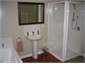 bathroom with shower and bath