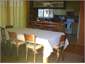 View from dining to kitchen - lots of recipe books
