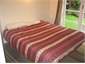 Upstairs bedroom with patio access