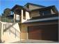 View of garage/front entrance/dining over garage