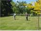 "The young and old" rivals at croquet PB 030001 WS