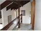 upstairs balcony leads to bedrooms