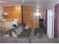 Large table and huge couch. Great woodburner.
