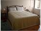 Large queen size bedroom with spa and ocean views