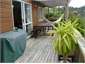 upstairs deck + doors to living rm