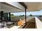 Sliding doors open out to decking north and west