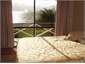 Queen bedroom looking out onto deck and lake.