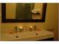 The Bathroom - Sink and Reflection of Shower