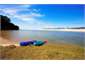 Kayaks on forshore in front of Cottage