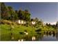 Misty ponds and lush gardens surround the resort