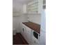 THE KITCHEN/LAUNDRY AREA