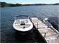 Ski and fishing boat at house jetty