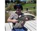 A happy guest catches his trout