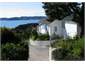 West Exterior of House and Sea Views beyond