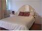 The master bedroom is elegant and light