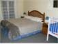 Large bedroom with king size bed and cot