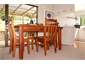 Four people can dine on this solid wood table