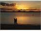Stroll along the beach at sunset.