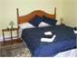 Yellow room kingsize bed