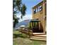 Side of house, lake and mountain