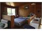 Double bed in sectioned off part of lounge