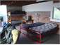 The large downstairs garage has four bunks.