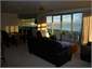 Apartment lounge and kitchen at sunset