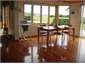Open-plan kitchen & dining area opening onto deck