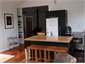 Kitchen through to lounge 2 with wood burner