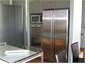 Kitchen with Stainless Steel Appliance & Pantry 