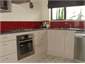 Full, clean sunny kitchen