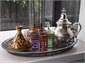 Enjoy a cup of Moroccan mint tea..