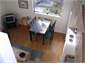view of kitchen, dining from mezzanine floor