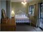 Downstairs bedroom with bathroom attached.