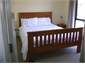 Downstairs queensize bed & portacot