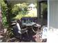 BBQ on Verandah with Playhouse in Back Garden