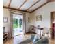 The living area opens to the verandah