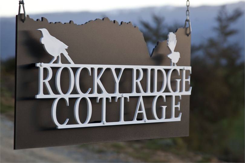 Sign with Tui and Fantail