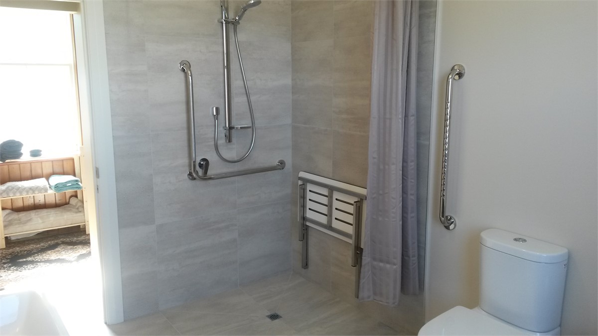 Wheelchair friendly shower and toilet.