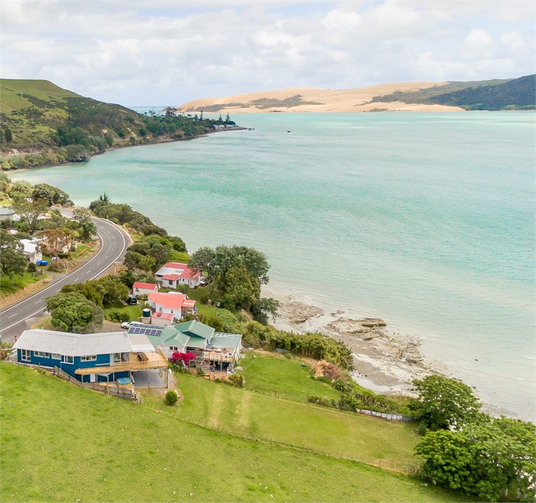 "Last house in Opononi" with its clifftop elevated