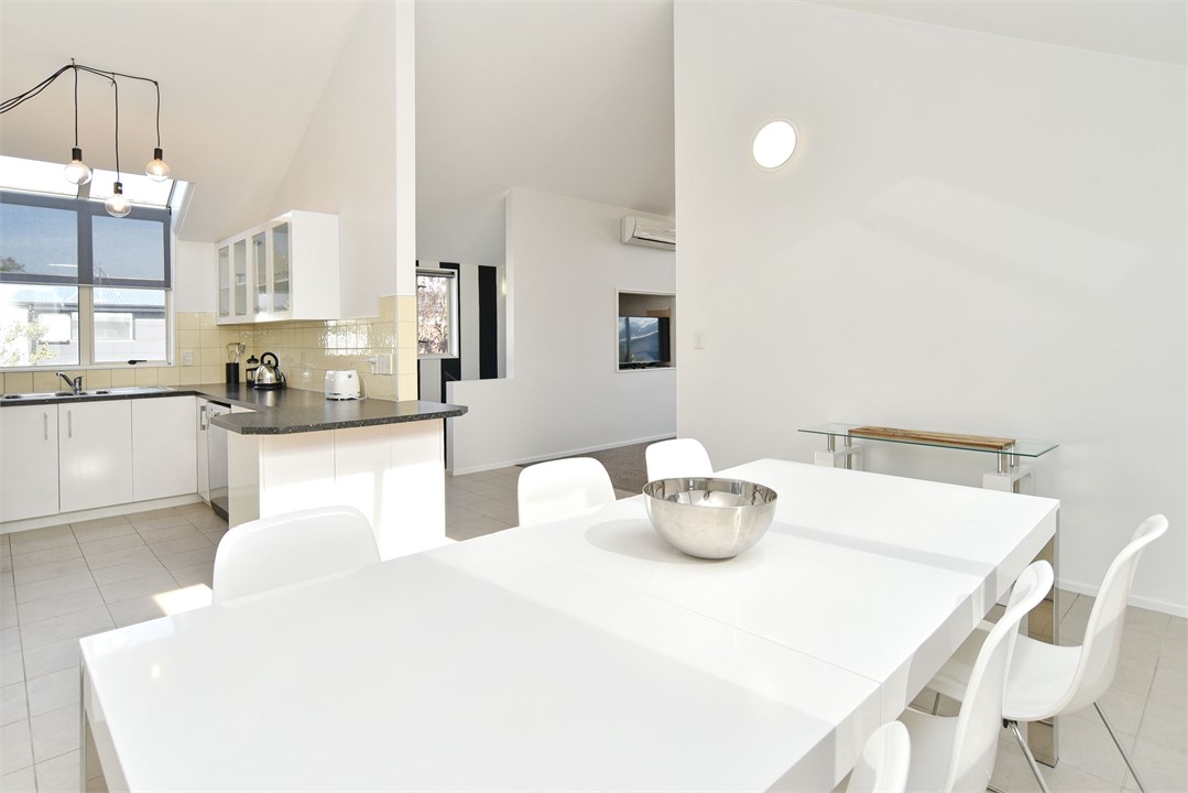The dining area flows into the kitchen and living 