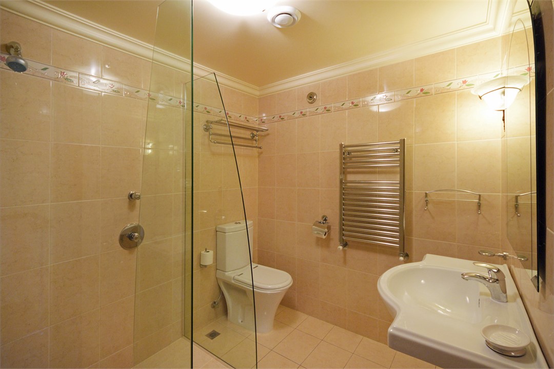 Bathroom with Frameless glass Shower, Toilet & Van