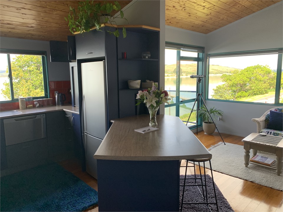 Kitchen flow into seating area and balcony