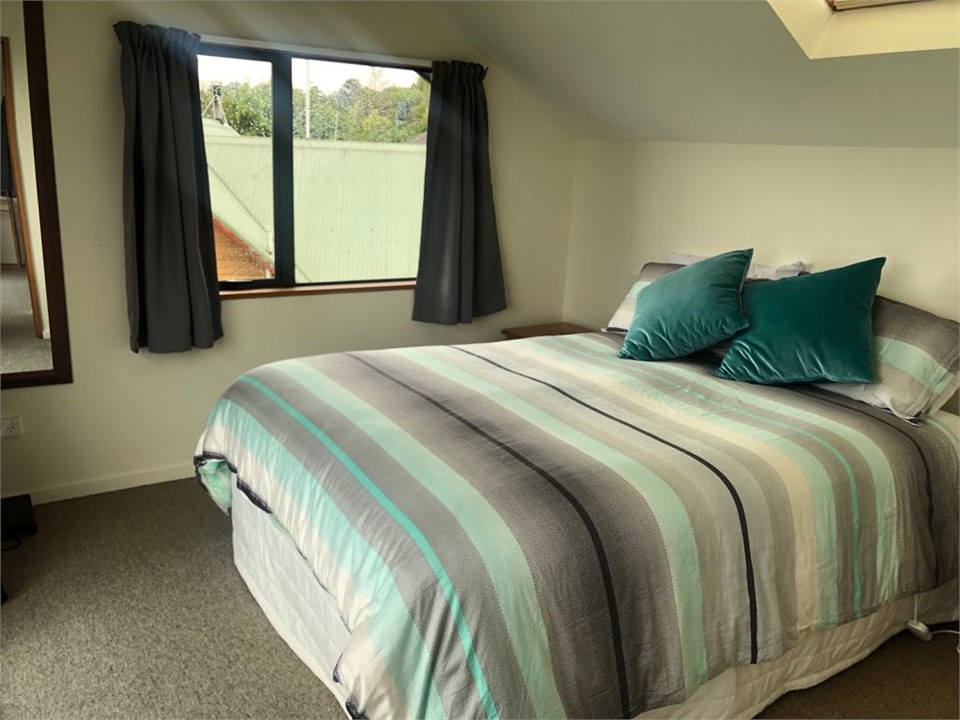 Upstairs bedroom (queen bed) with full lake view