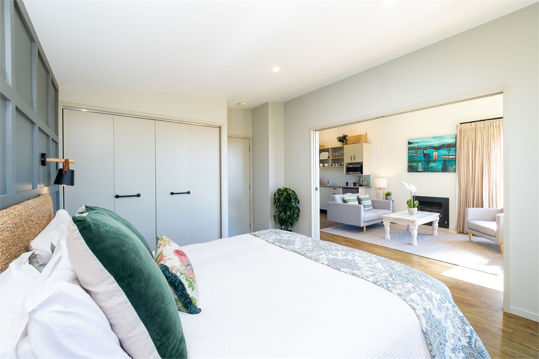 slider doors between bedroom and living area