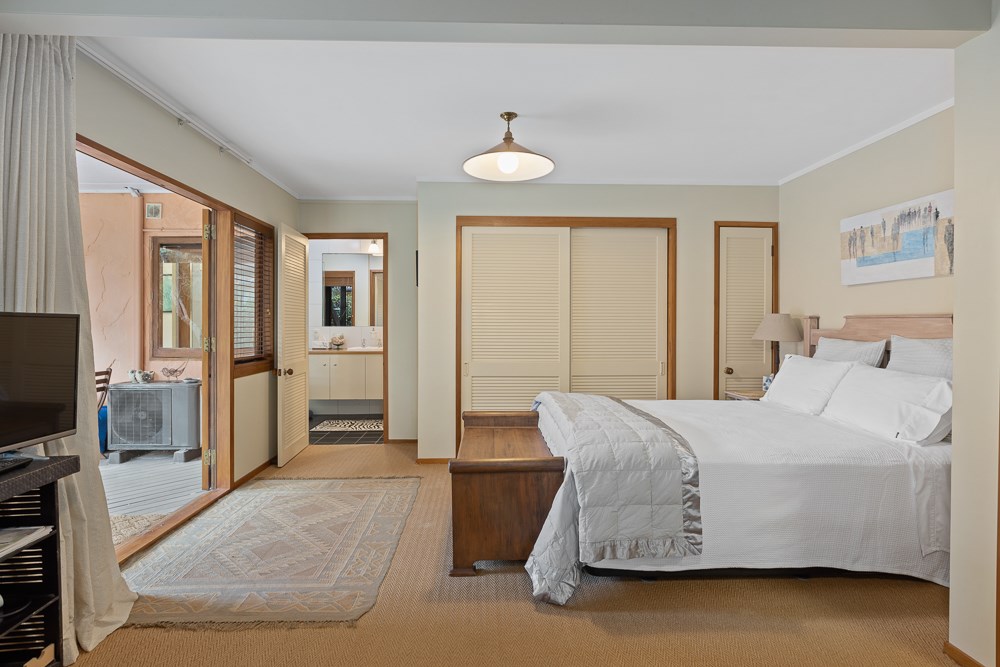Master bedroom suite with entry to adjoining ensui