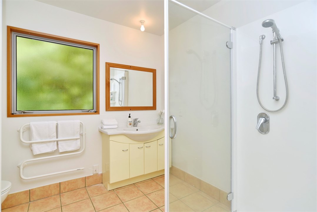 Bathroom 2 has a shower and a toilet